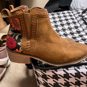 Brown booties with floral embroidery on heel